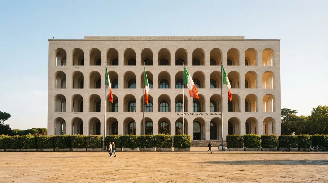 Palazzo istituzionale con bandiere al vento in una piazza soleggiata — casino online senza registrazione
